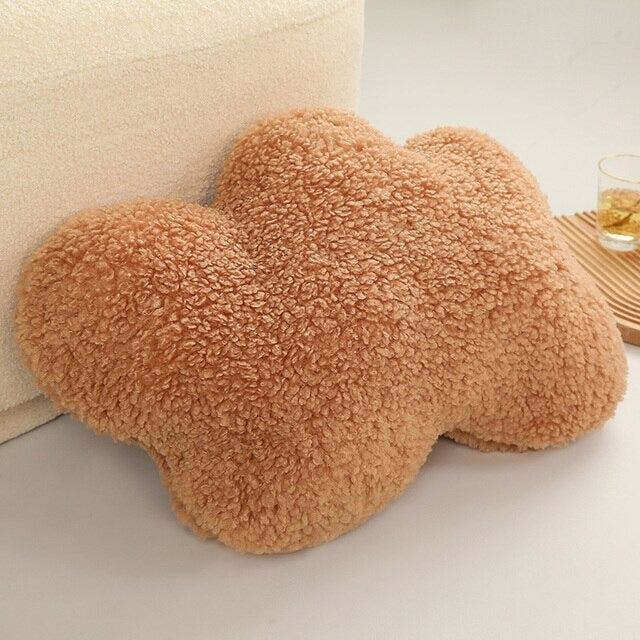 a cinnamon cloud-shaped pillow