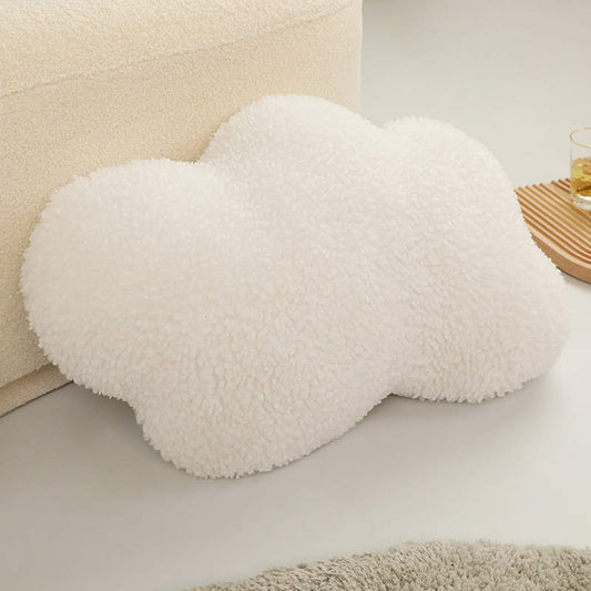 a white cloud-shaped pillow
